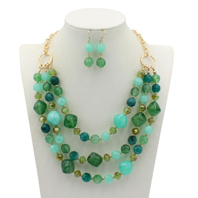 Comercio al por mayor de múltiples capas de plástico aretes collar conjunto de joyas